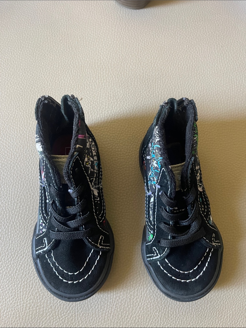 Vans Kids Black High-Top Sneakers with Colorful Graffiti Accents